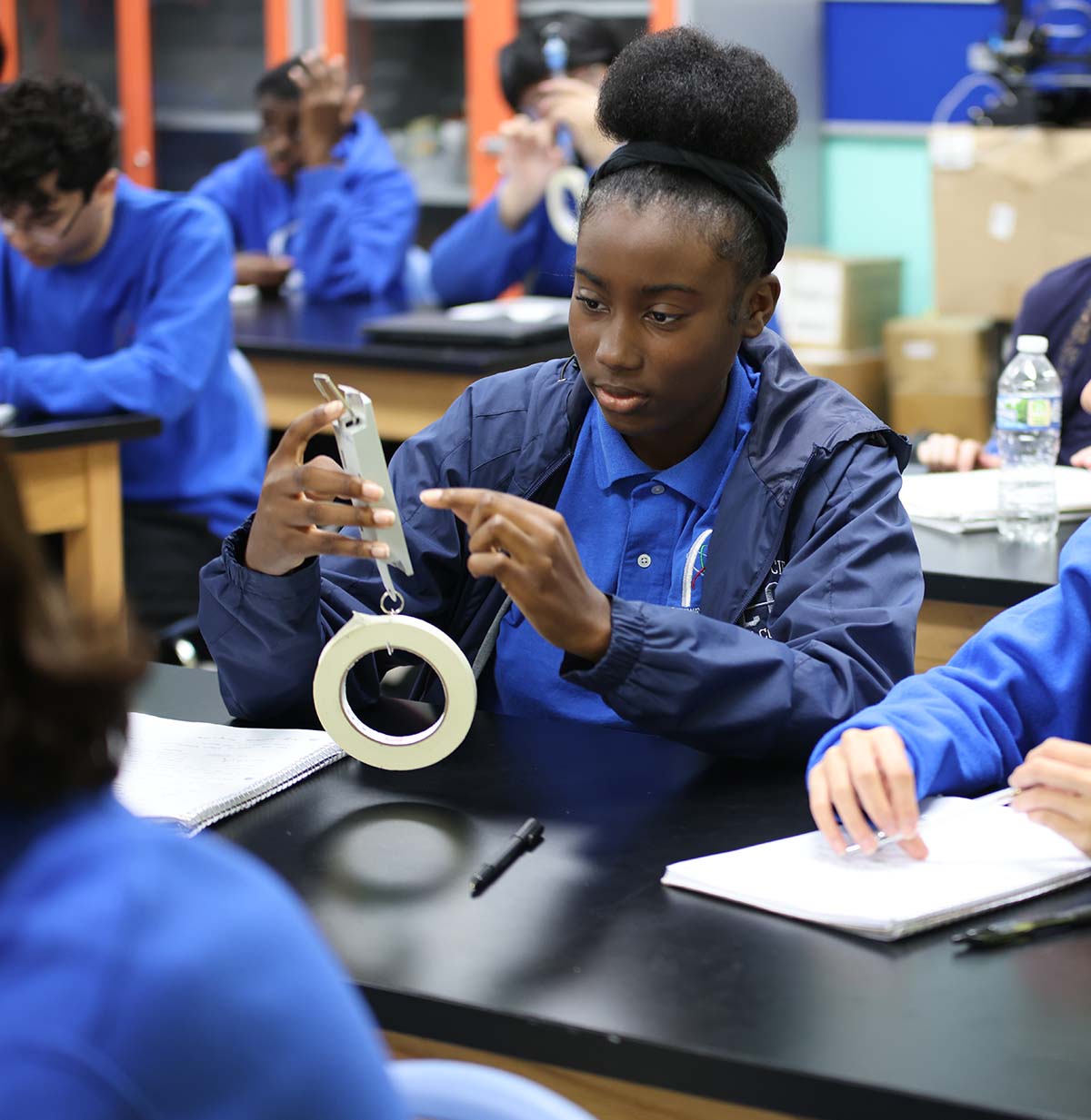 Student drawing in a classroom.