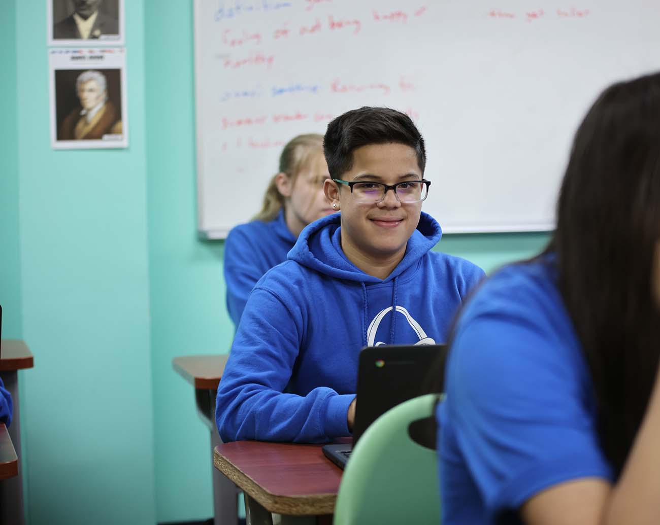 Teacher or school staff member warmly interacting with a student outside